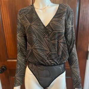Fancy sparkly bodysuit.  Black with silver and gold metallic detailing